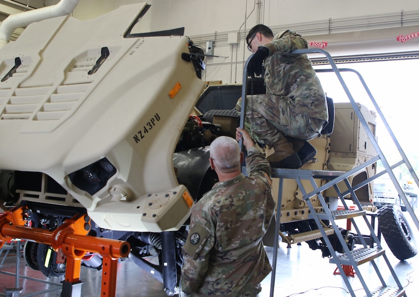 Sgt. 1st Class Miguel Rivera ensure Soldiers are being safe as they conduct troubleshooting operations. 94th Training Division award winning Regional Training Site Maintenance Fort Indiantown Gap (RTSM-FIG), graduated its latest Wheeled Vehicle Mechanics reclass course.