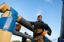 U.S. Marine Corps Cpl. Angel Mendoza, a regimental training non-commissioned officer with Combat Logistics Regiment 37, 3d Marine Logistics Group, prepares to jump over an obstacle during a Martial Arts Instructor course at Camp Kinser, Okinawa, Sept. 25, 2023. The purpose of the Martial Arts Instructor course is to train Marines to be knowledgeable and proficient Marine Corps Martial Arts Program instructors who can then train other Marines to be more lethal and instill a warrior's mindset. (U.S. Marine Corps photo by Staff Sgt. Danny Gonzalez)