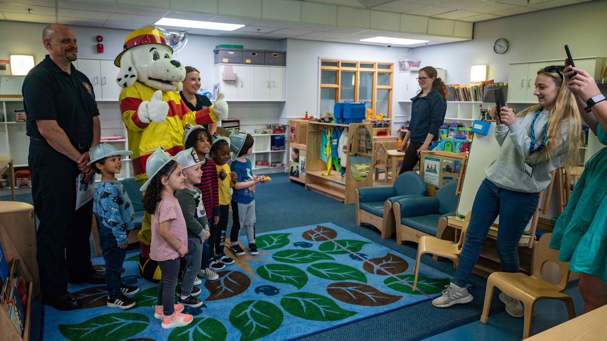 The 100th Civil Engineer Squadron Fire Department hones on this year’s fire prevention week with the message “Cooking safety starts with you” at Royal Air Force Mildenhall, England, Oct. 11, 2023. Sparky the Fire Dog and members of the 100th Civil Engineer Squadron Fire Department read fire safety books and provided handouts to pre-school classes at the 100th Force Support Squadron Child Development Center, strengthening military family morale and increasing awareness. (U.S. Air Force photo by Senior Airman Viviam Chiu)