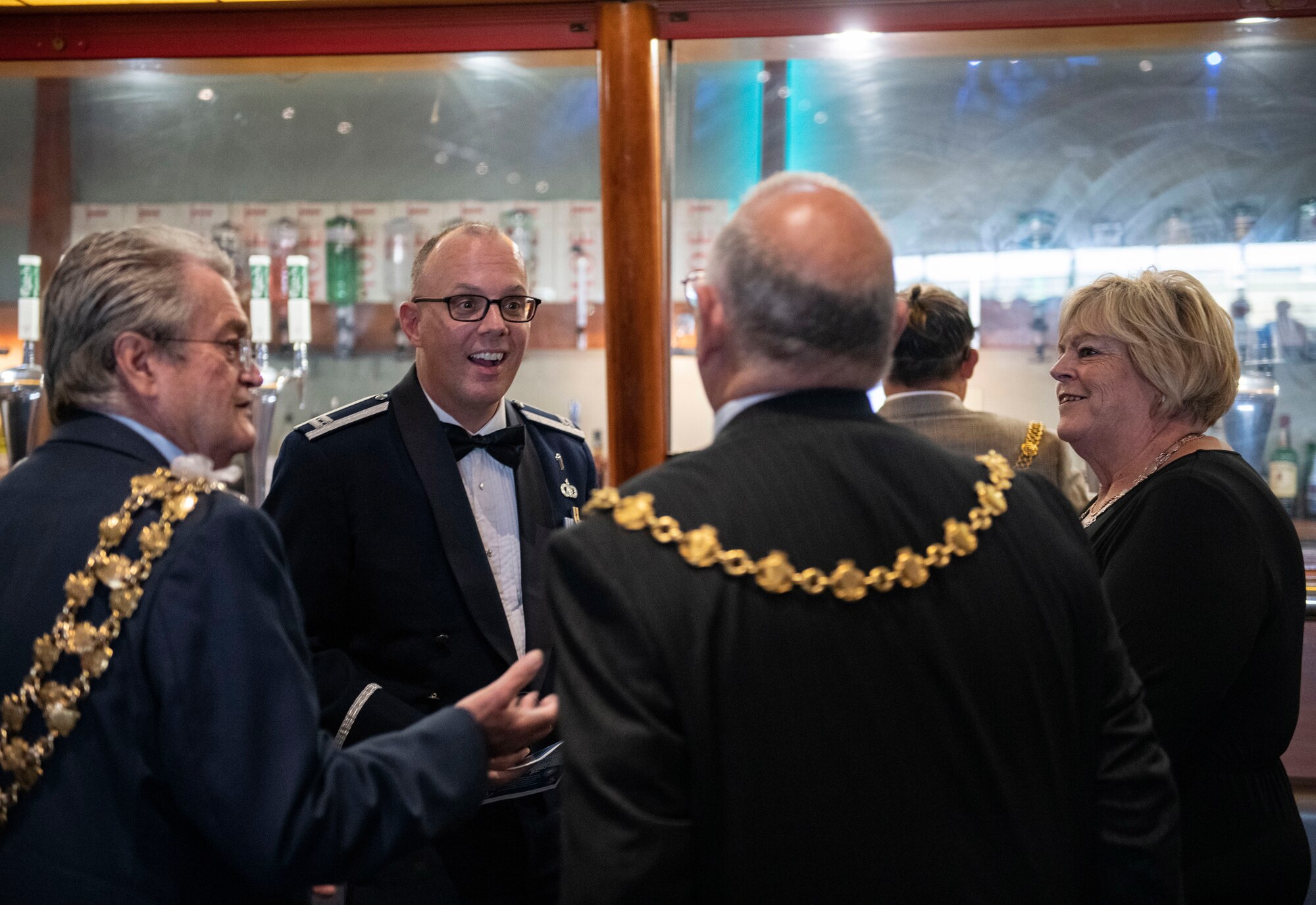 Capt. Steven Davis, 501st Combat Support Wing chaplain, center left, speaks with local civic leaders at Sywell Aerodrome