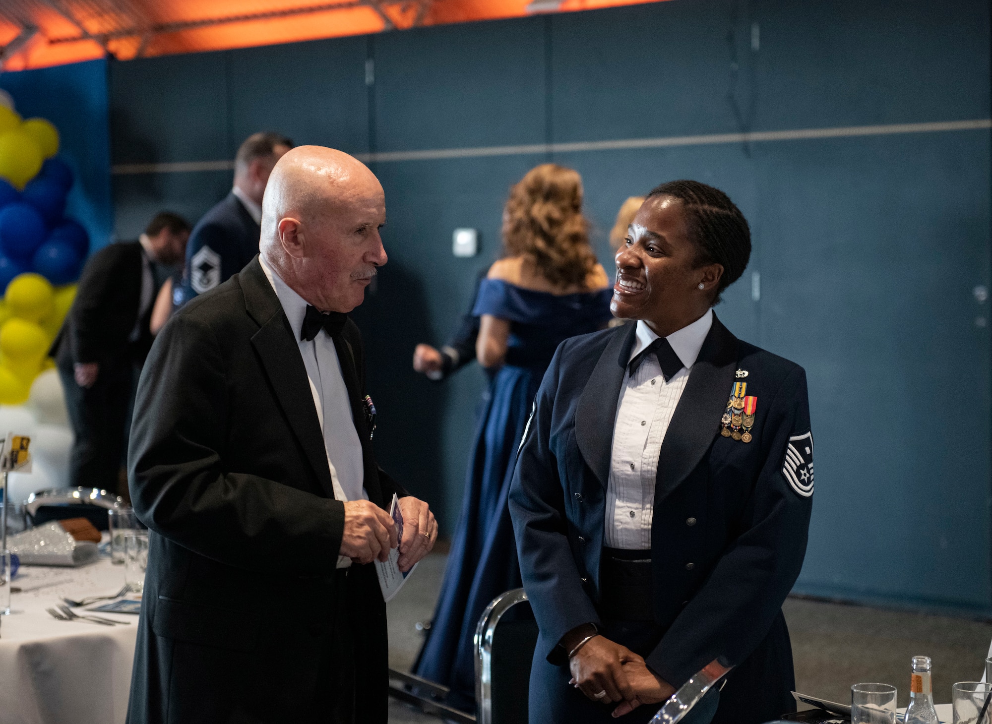 Warrant Officer 1st Class (RET) John Martin O’Kelly, left, speaks with Master Sgt. Sirivia Rice, 423d Security Forces Squadron first sergeant, at Sywell Aerodrome