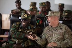 Army Maj. Gen. Todd Wasmund, commander of U.S. Army Southern European Task Force, Africa, and Ghana’s military leadership share a lighthearted moment following the culminating exercise at African Lion 2023 near Daboya, Ghana, June 13, 2023.