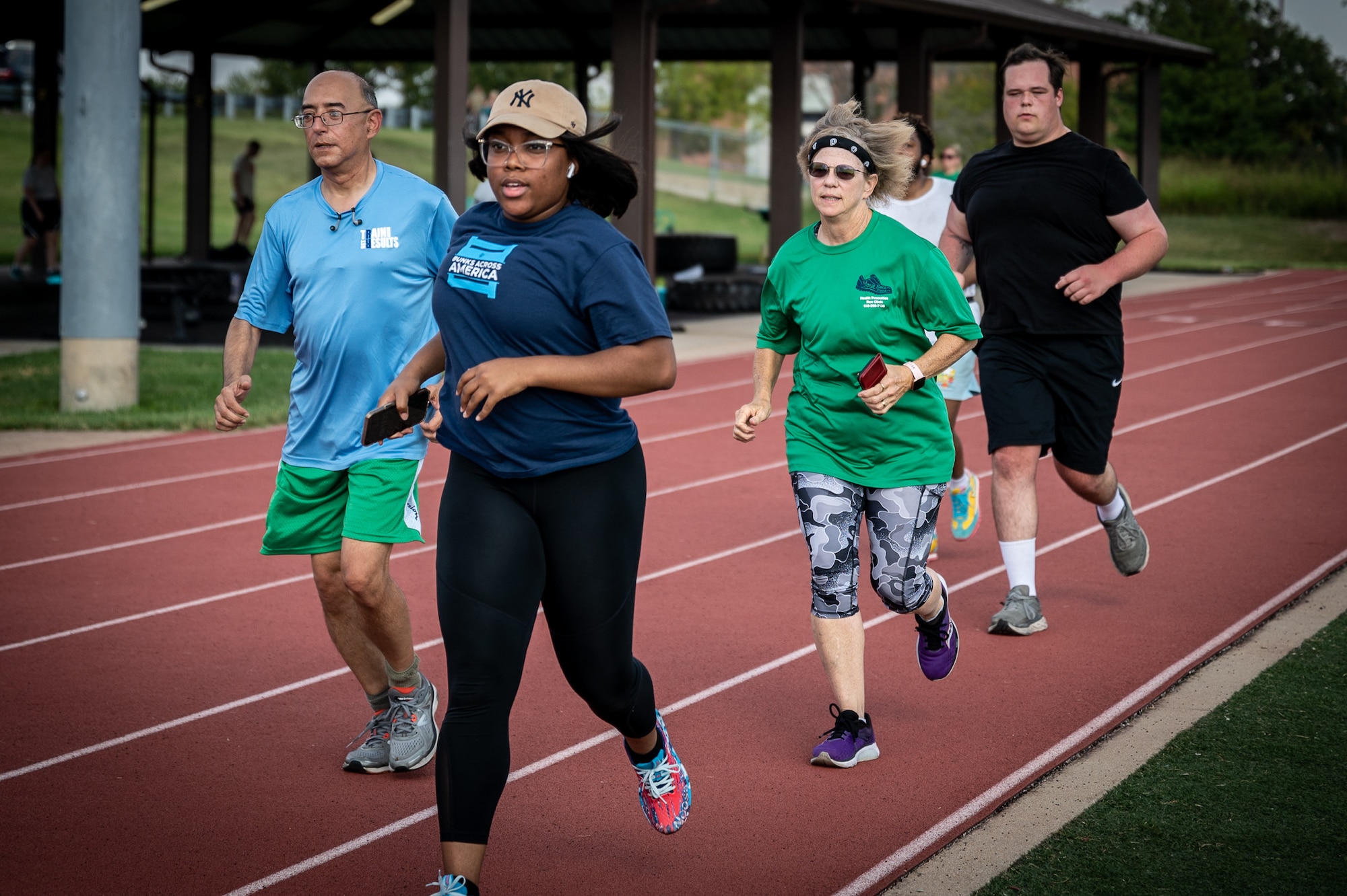 Deb Teague, in the green shirt, is the 932nd Military and Family Readiness Center program manager, volunteers as a run coach, Oct. 13, 2023, Scott Air Force Base, Illinois. (U.S. Air Force photo by Christopher Parr)