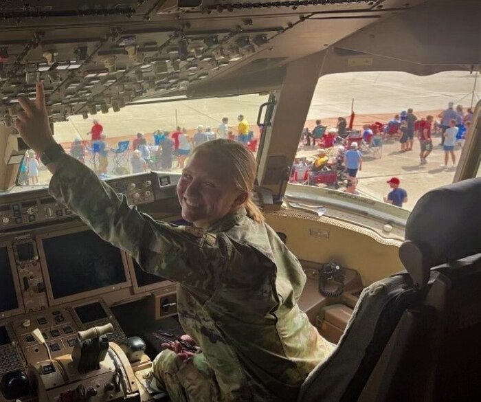 Image of Senior Airman Abigail Sherbondy, 931st Maintenance Squadron reclamation journeyman, inside the cockpit of an aircraft at an airshow.