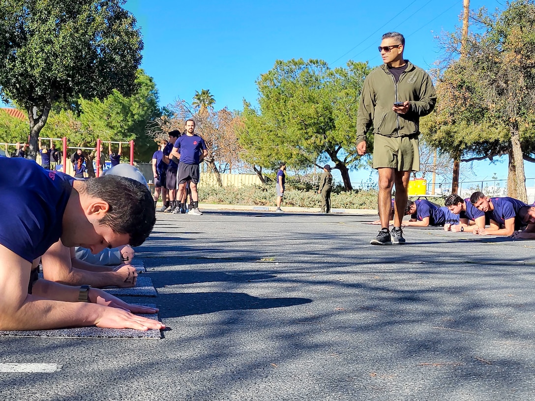 Future Marines in the delayed entry program with Recruiting Station Riverside, 12th Marine Corps District, participate in an initial strength test (IST) at the Recruiting Station Riverside Headquarters on March Air Reserve Base, California on Jan. 23, 2023. The IST is a shortened version of the physical fitness test (PFT) conducted to gauge the physical readiness of future Marines. (U.S. Marine Corps photo by Sgt. Cutler Brice)