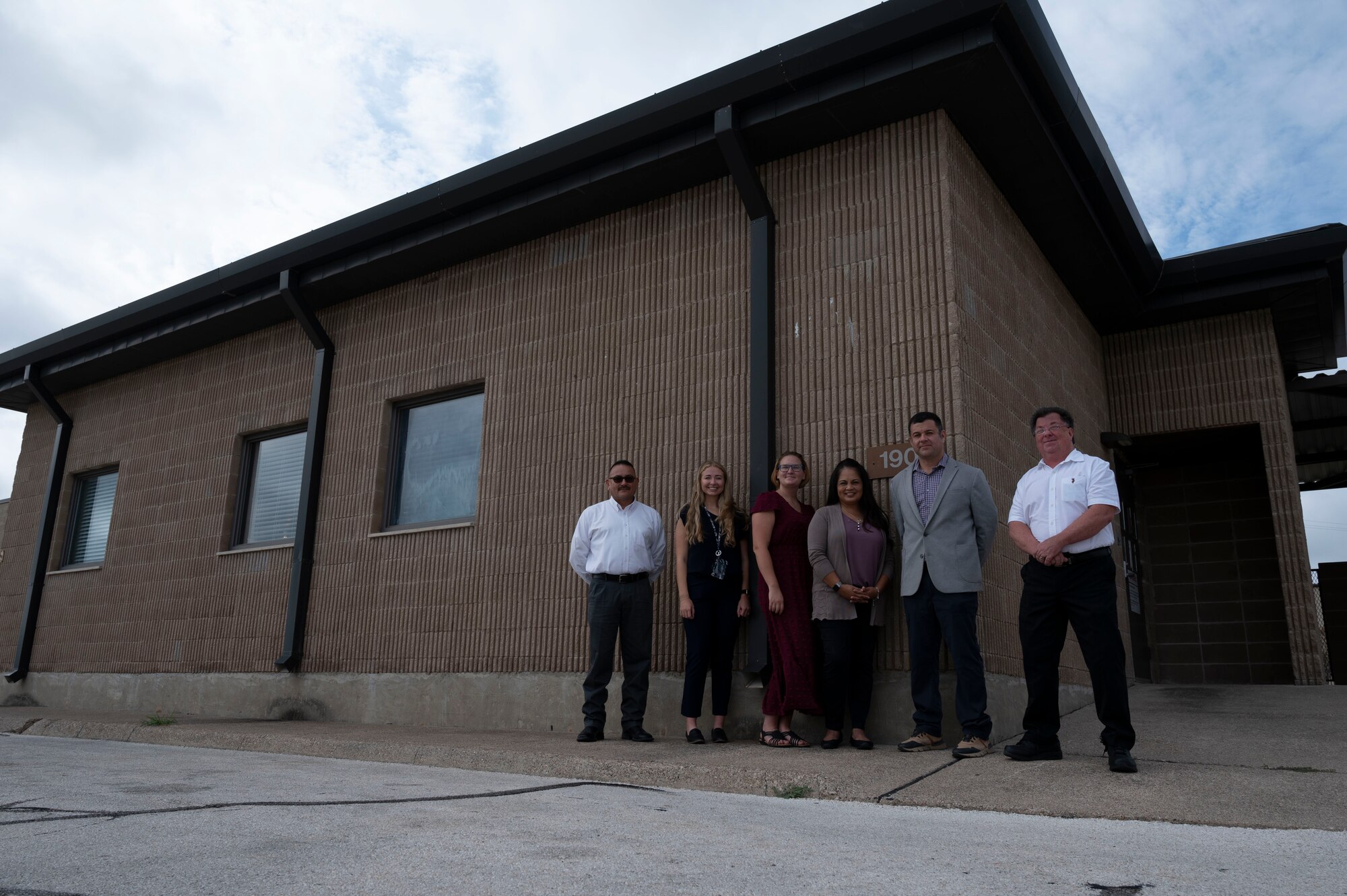 Members of the development team for the Civilian Resource Center, 47th Flying Training Wing, stand outside the newly-open center during a kick-off ceremony at Laughlin Air Force Base, Texas, Oct. 4, 2023. The goal of opening this location was to provide a safe space for 47th Flying Training Wing’s civilian workforce, and more specifically 47th Maintenance Directorate maintainers, to relax, gain insight on professional development, and find wellness resources. (U.S. Air Force photo by Airman 1st Class Kailee Reynolds)