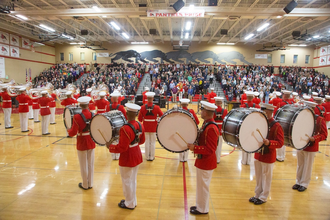 The Silent Drill Platoon and The Commandant's Own Drum & Bugle Corps, both attached to Marine Barracks Washington, perform for Snohomish High School in Snohomish, Washington, on March 8, 2023. Then Silent Drill Platoon is a 24-man rifle platoon that performs a unique precision drill exhibition. The Commandant's Own Drum and Bugle Corps, also known as "The Commandant's Own," combines contemporary songs and traditional marching music with uniquely choreographed drill movements. These two units exemplify the professionalism associated with the US Marine Corps. (U.S. Marine Corps photo by Sgt. Stephen Campbell)