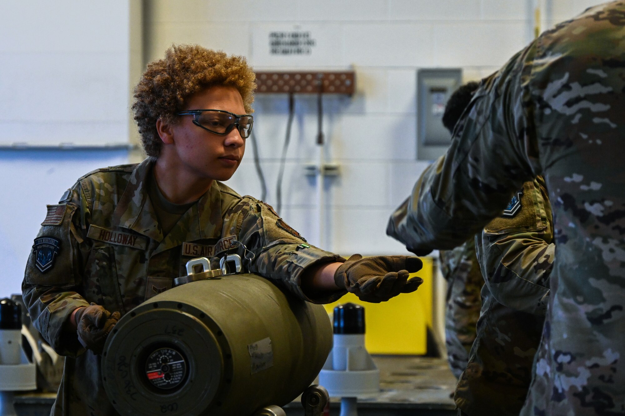 Airman 1st Class Amarissa Holloway, 5th Munitions Squadron munitions line delivery specialist, builds an Mk-82 ordnance during Operation Tundra Swan at Minot Air Force Base, North Dakota, Oct. 2, 2023. Munition systems Airmen like Holloway store, assemble, account for and transport weapons systems. (U.S. Air Force photo by Airman 1st Class Alyssa Bankston)