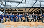 SECNAV Carlos Del Toro, center left, participates in a groundbreaking ceremony for a new Accelerated Training in Defense Manufacturing (ATDM) Regional Training Center in Danville, Virginia.