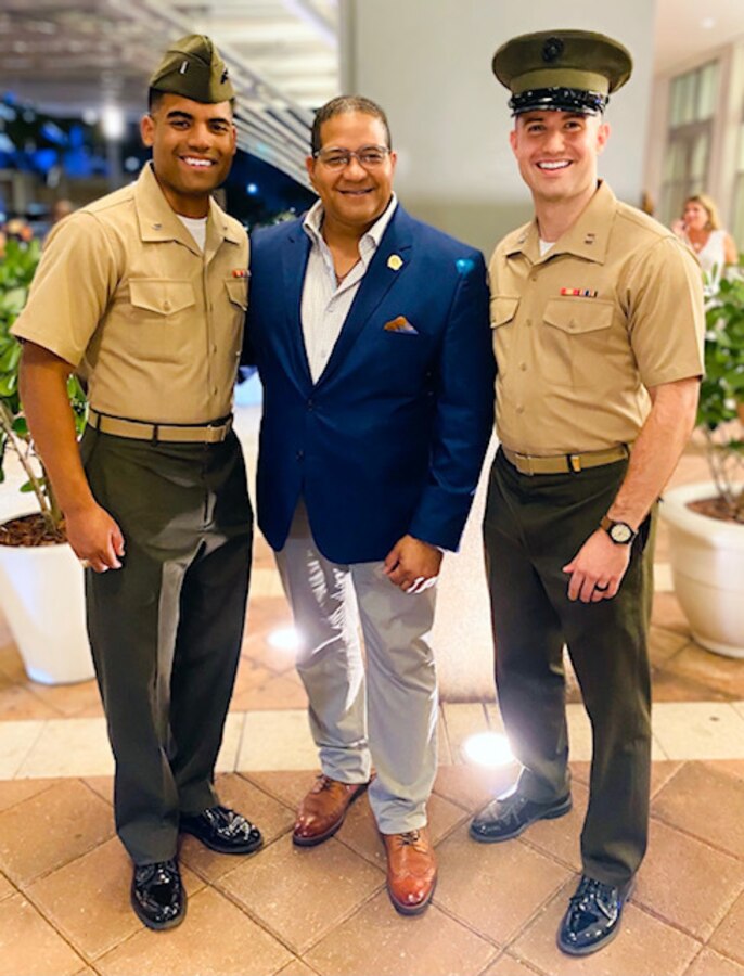 1stLt Roman Zepeda and Capt Steven Arango, Jr., pose with Roberto Clemente, Jr., son of late Hall of Famer Major League Baseball player, Roberto Clemente