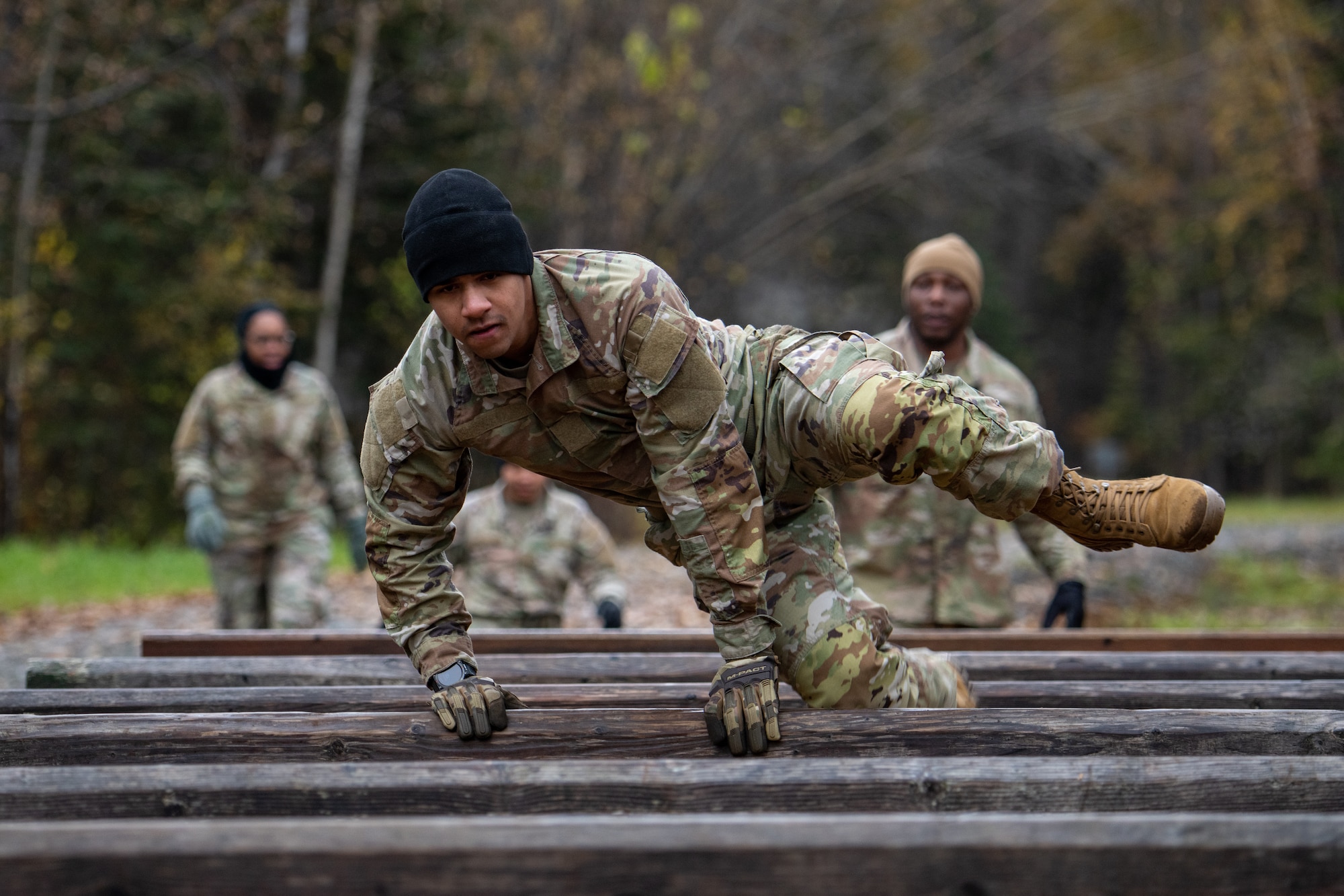 U.S. Army Soldiers assigned to the 95th Chemical Company, 17th Combat Sustainment Support Battalion, 2nd Infantry Brigade Combat Team (Airborne), 11th Airborne Division, compete in an obstacle course at Joint Base Elmendorf-Richardson, Alaska, Oct. 5, 2023.