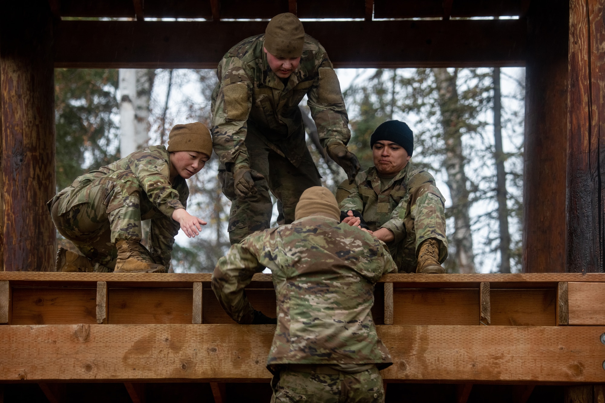 U.S. Army Soldiers assigned to the 95th Chemical Company, 17th Combat Sustainment Support Battalion, 2nd Infantry Brigade Combat Team (Airborne), 11th Airborne Division, compete in an obstacle course at Joint Base Elmendorf-Richardson, Alaska, Oct. 5, 2023.
