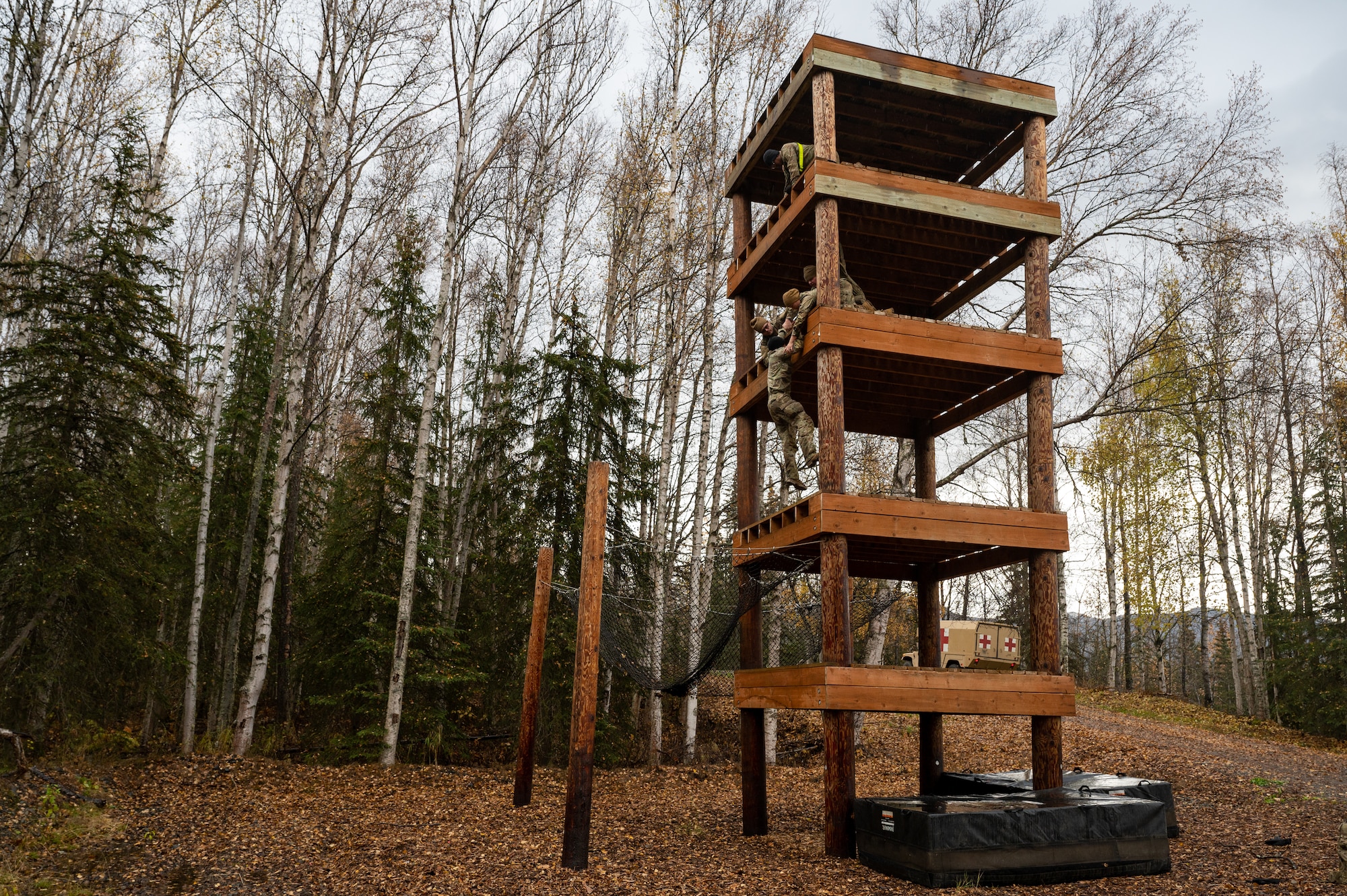 U.S. Army Soldiers assigned to the 95th Chemical Company, 17th Combat Sustainment Support Battalion, 2nd Infantry Brigade Combat Team (Airborne), 11th Airborne Division, compete in an obstacle course at Joint Base Elmendorf-Richardson, Alaska, Oct. 5, 2023.