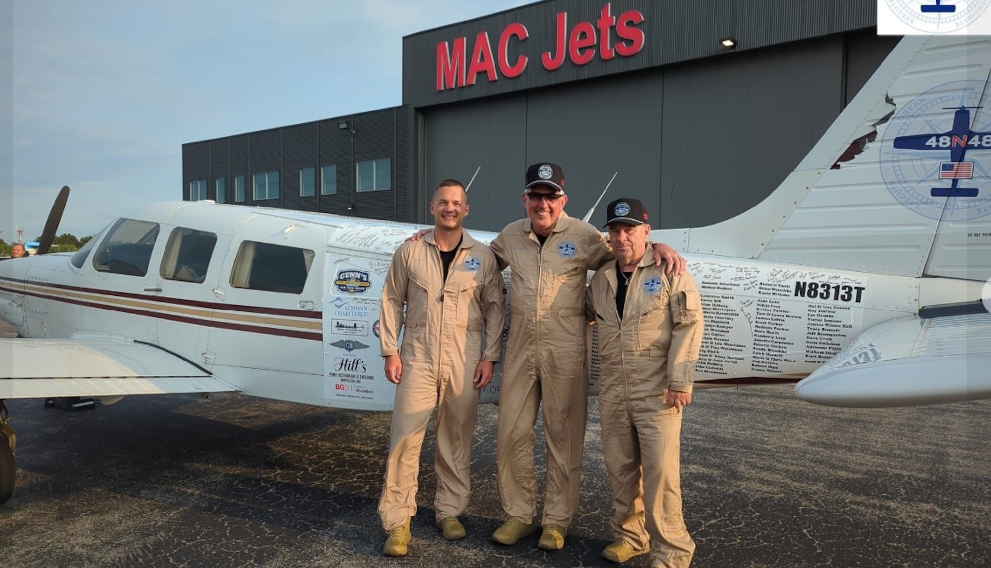 (Left to right) Lt. Col. Aaron Wilson, 89th Airlift Squadron C-17 pilot, Barry Behnfeldt and Thomas Twiddy pose after landing at the Henry County Airport in South Portland, Maine, June 6, 2023 after flying across 48 contiguous U.S. states in less than 48 hours.