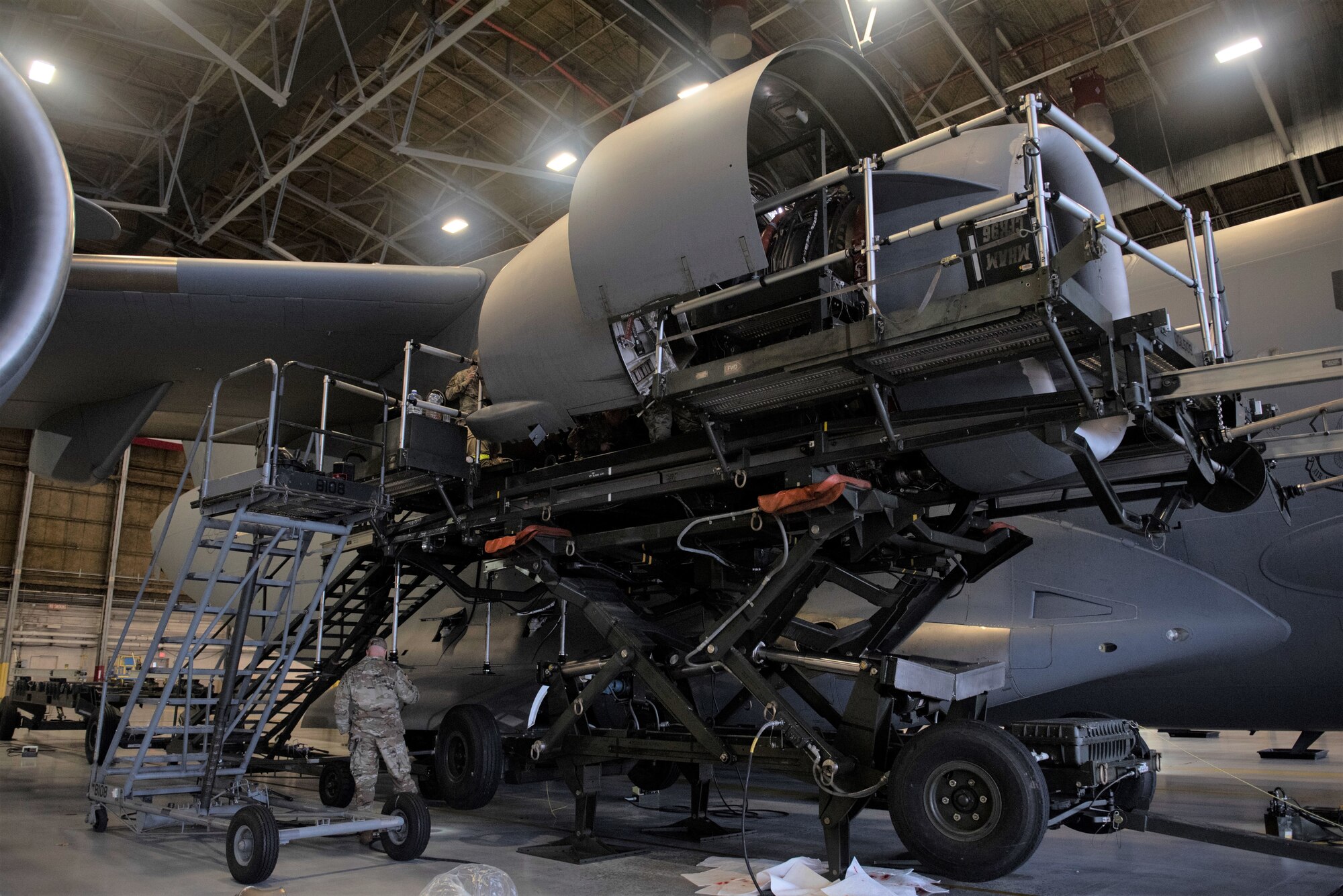 Maintainers with the 62d AMXS and MXS worked together to disassemble and remove a damaged engine and replace it with a serviceable one. (U.S. Air Force photo by Airman 1st Class Kylee Tyus)
