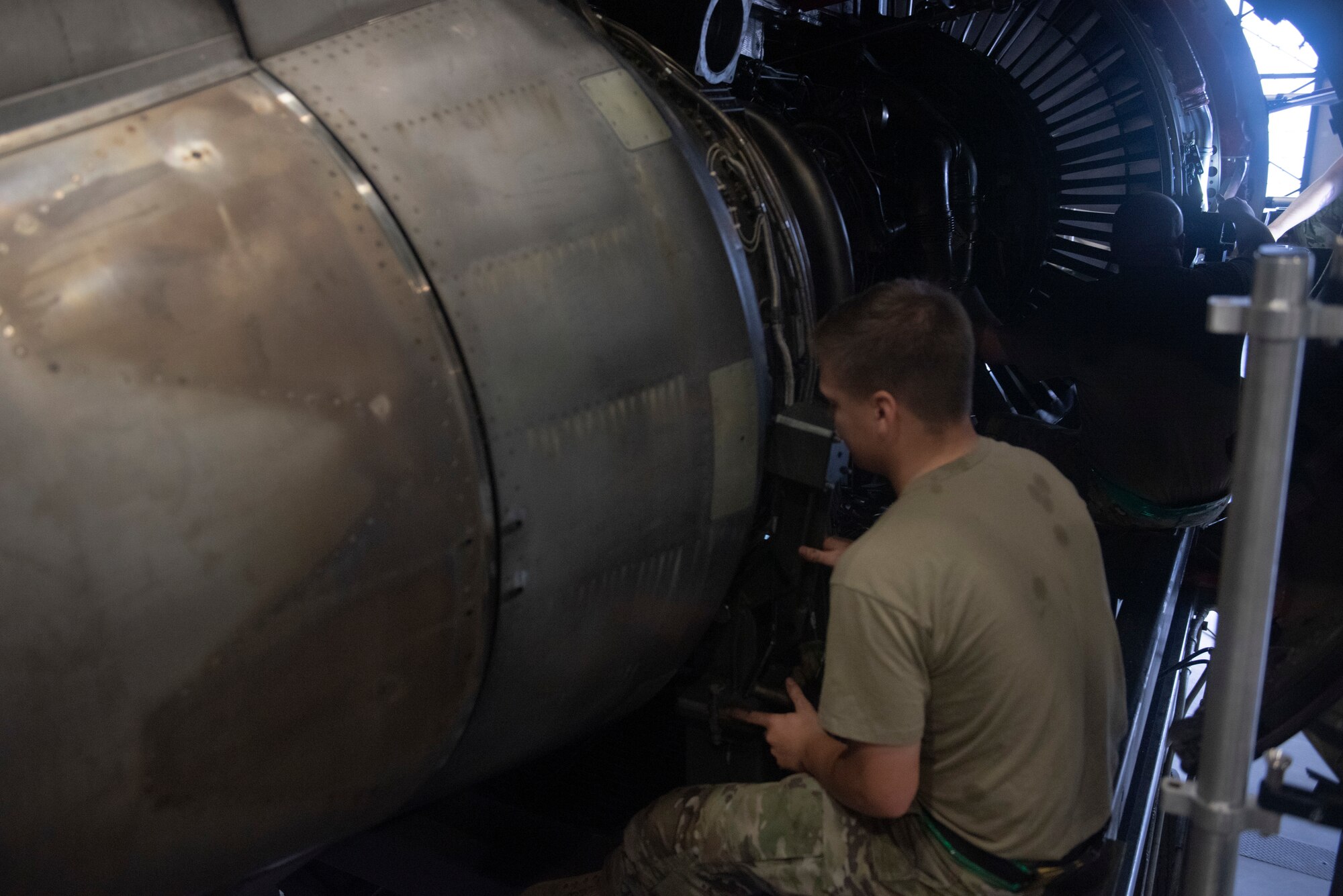 Maintainers with the 62d AMXS and MXS worked together to disassemble and remove a damaged engine and replace it with a serviceable one. (U.S. Air Force photo by Airman 1st Class Kylee Tyus)
