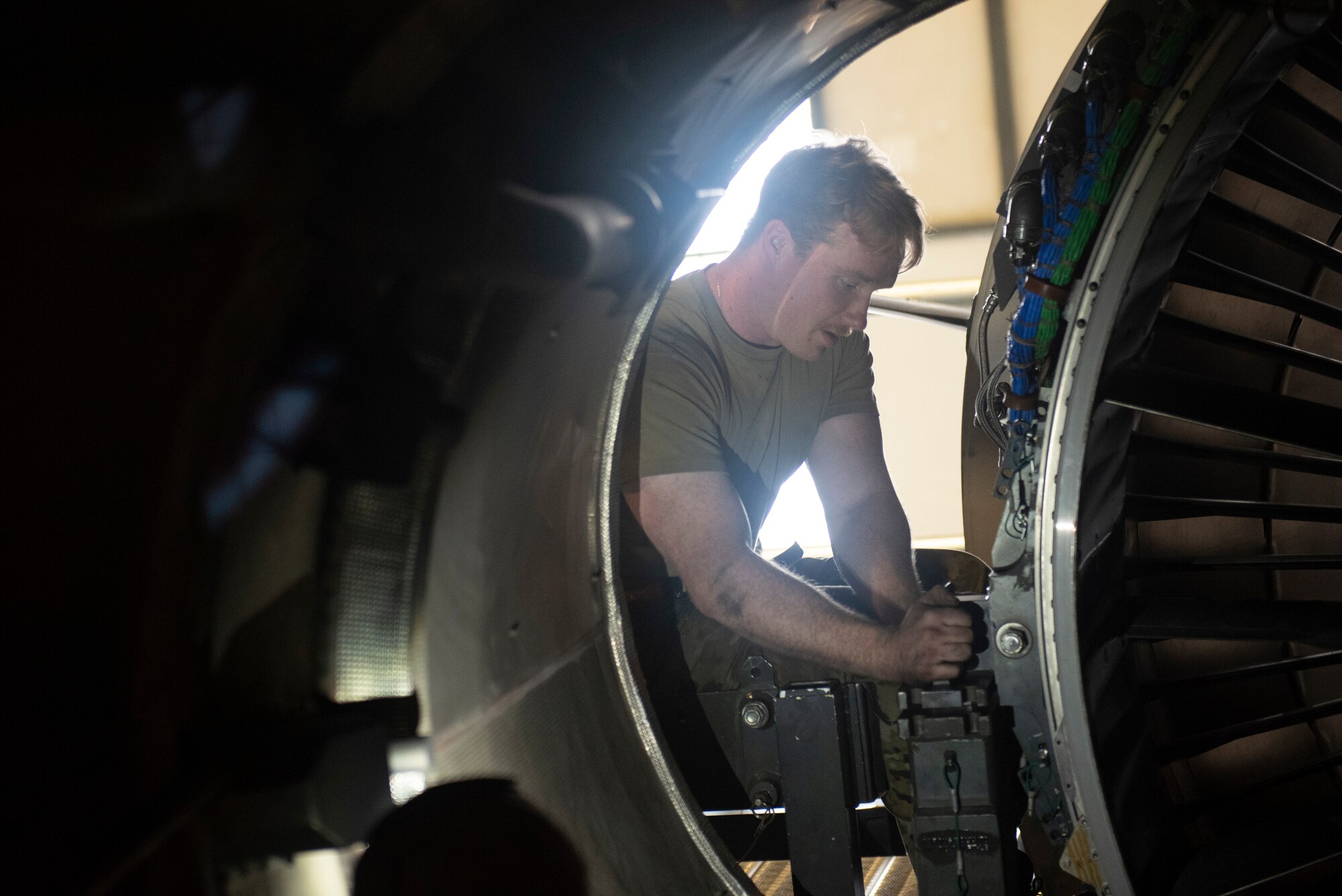 Maintainers with the 62d AMXS and MXS worked together to disassemble and remove a damaged engine and replace it with a serviceable one. (U.S. Air Force photo by Airman 1st Class Kylee Tyus)
