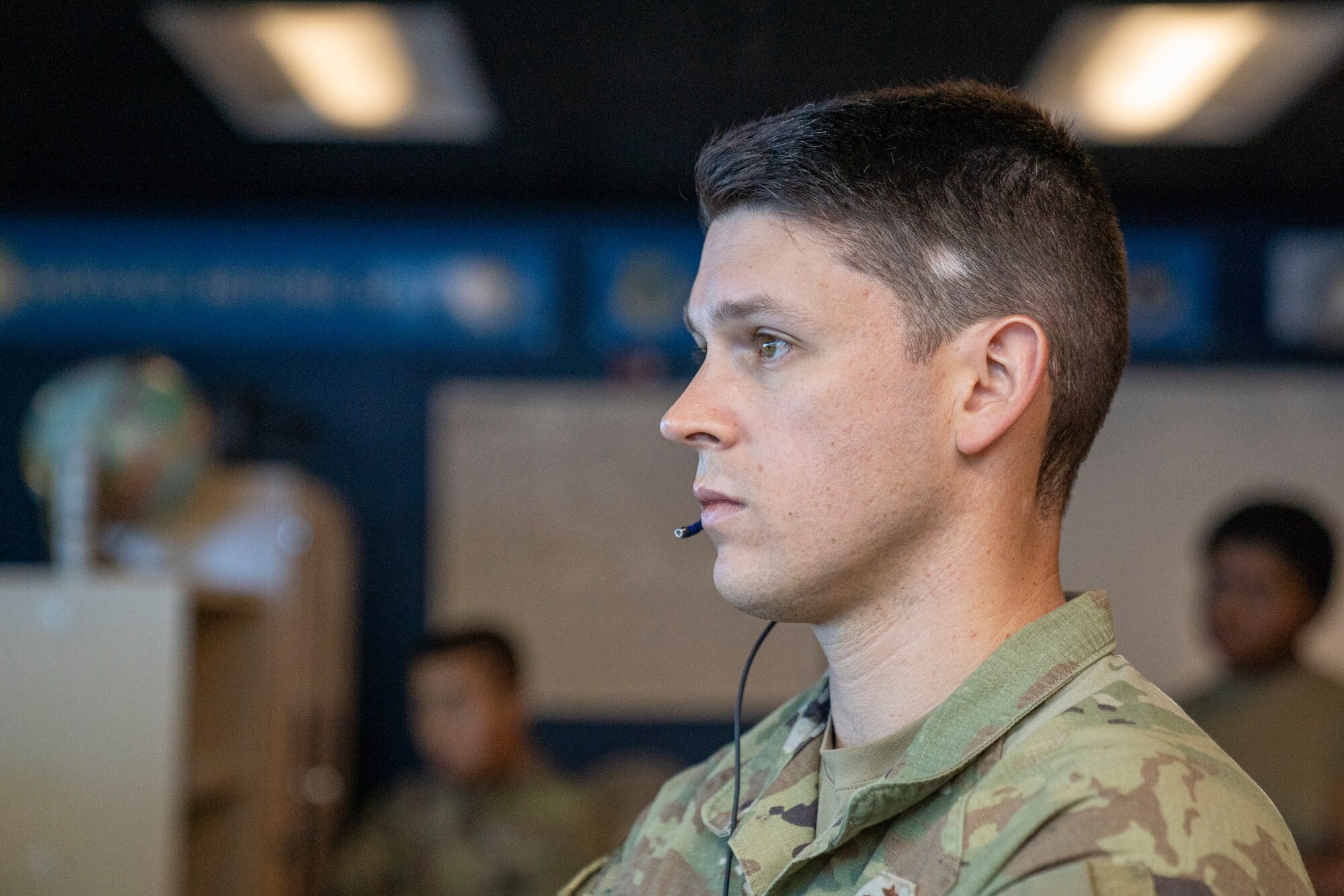 U.S. Air Force Staff Sgt. Michael Russell, 334th Training Squadron air traffic control instructor, observes a student taking their daily practical assessment at Keesler Air Force Base, Mississippi, Sept. 26, 2023.