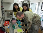 Maj. Nicholas A. Magno (right) from the U.S. Army's 1st Area Medical Laboratory performs hands-on training in the Republic of Korea Chemical, Biological, Radiological, Nuclear (CBRN) Defense Command field analytical biology laboratory. Soldiers from the 1st Area Medical Laboratory trained with South Korean troops from the Republic of Korea CBRN Defense Command at their headquarters outside of the South Korean capital of Seoul. Courtesy photo.