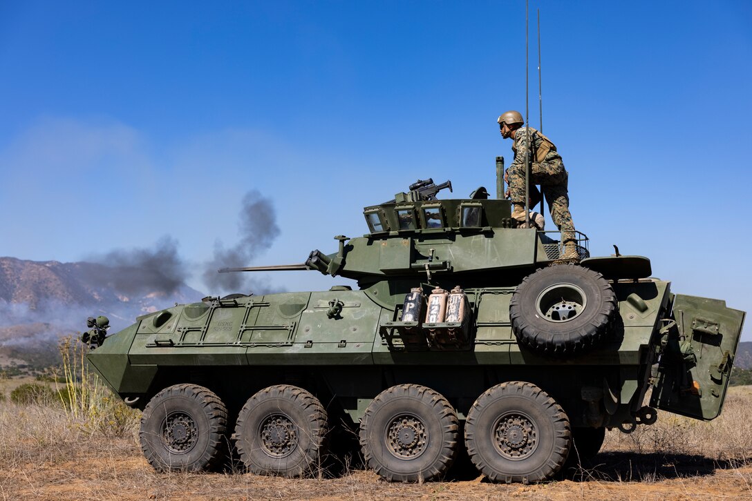 U.S. Marines with 1st Light Armored Reconnaissance Company, 1st Marine Division, I Marine Expeditionary Force and 7th Singapore Infantry Brigade Guardsmen use a light armored vehicle canon to destroy targets during Exercise Valiant Mark 2023 at Camp Pendleton, CA, Oct. 10, 2023. Valiant Mark 23 is an annual, bilateral training exercise conducted between the Singapore Armed Forces and I Marine Expeditionary Force, designed to enhance interoperability, improve combined arms and amphibious warfighting skills, and strengthen military-to-military relationships. (U.S. Marine Corps photo by Sgt. Nicolas Atehortua)