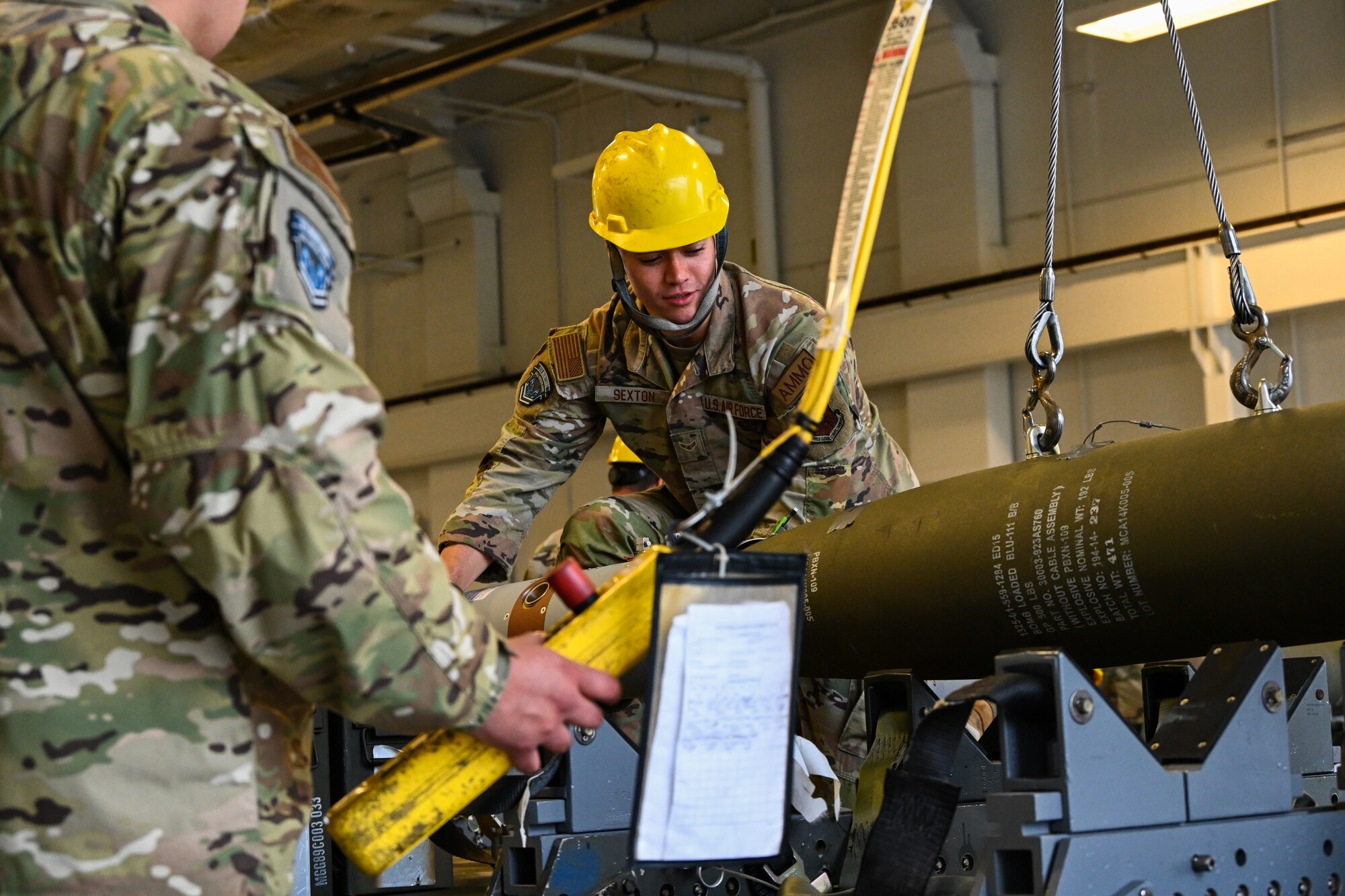 Airman 1st Class Trevor Sexton, 5th Munitions Squadron munitions line delivery crew chief, loads an Mk-82 ordnance during Operation Tundra Swan at Minot Air Force Base, North Dakota, Oct. 2, 2023. Operation Tundra Swan is a 5th MUNS exercise that implements the Agile Combat Employment concept and focuses on training efforts in scenarios where Airmen might not have everything they expect to produce ordnance from a decentralized location. (U.S. Air Force photo by Airman 1st Class Alyssa Bankston)