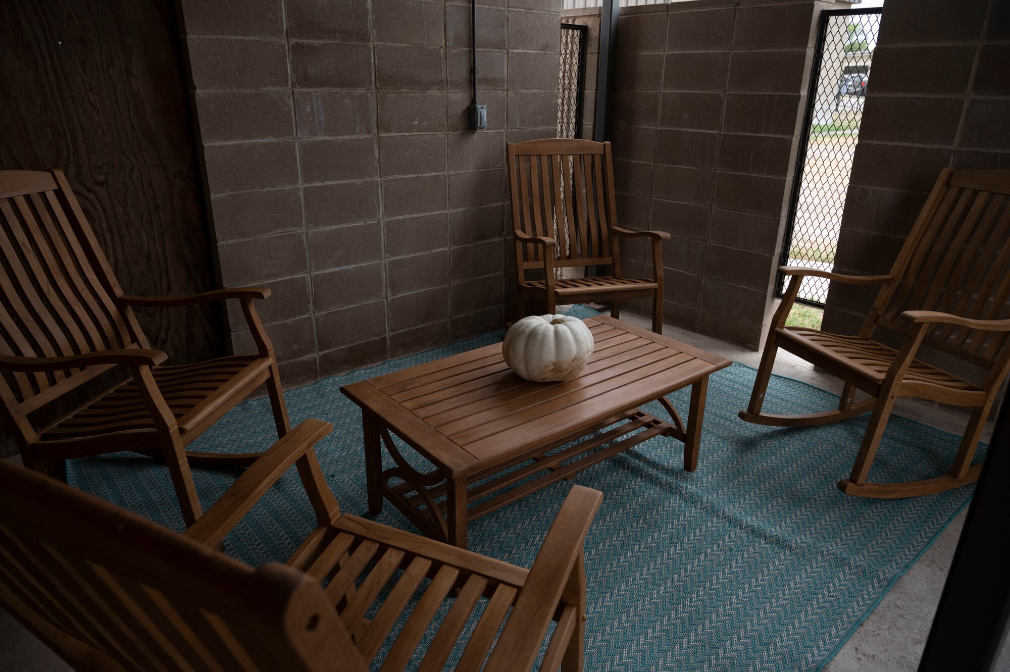 An outdoor sitting area stands outside the Civilian Resource Center in Building 190 at Laughlin Air Force Base, Texas, Oct. 4, 2023. The Civilian Resource Center was opened to provide a safe space for 47th Flying Training Wing’s civilian workforce, and more specifically 47th Maintenance Directorate maintainers, to build their resilience through relaxation, professional development and wellness resource awareness. (U.S. Air Force photo by Airman 1st Class Kailee Reynolds)