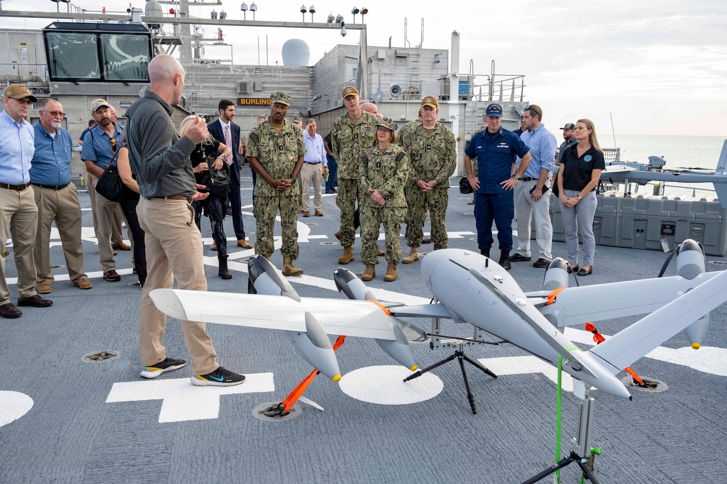 Vice Chief of Naval Operations Adm. Lisa Franchetti, center, receives a platform familiarization tour during the Navy's Hybrid Fleet event at Naval Station Key West.