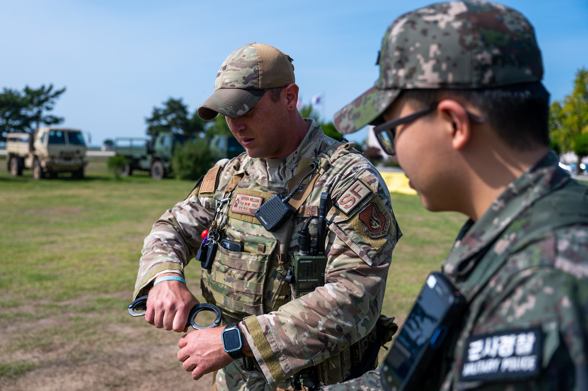 U.S. Air Force Staff Sgt. William Herron Republic of Korea Air Force Airmen 1st Class Huiseop Lin train techniques, tactics and procedures in preparation for the first-ever combined security patrol.