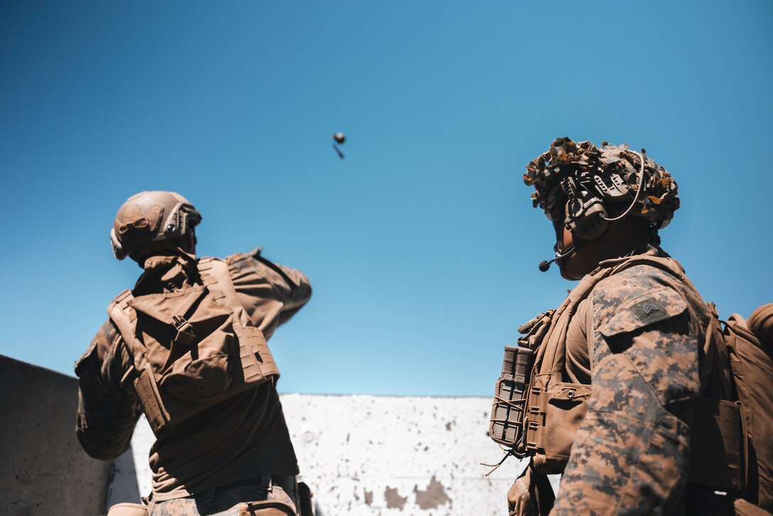 A U.S. Marine with 3d Littoral Combat Team, 3d Marine Littoral Regiment, 3d Marine Divison, throws a grenade down range at Pohakuloa Training Area, Hawaii, Oct. 8, 2023. Prior to participating in Joint Pacific Multinational Readiness Center Exercise from Oct. 26 – Nov. 9, a company of Marines with 3d LCT is conducting the final phase of their training work-up cycle on the Big Island, Hawaii.