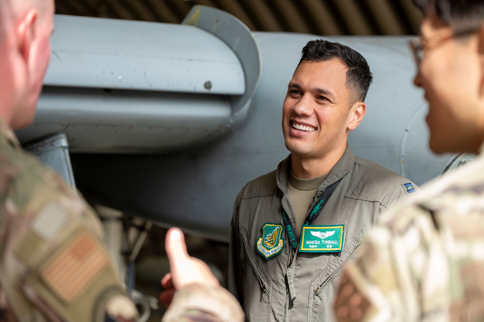 U.S. Air Force Capt. Makoa Tyndall, 25th Fighter Squadron director of staff, gives a tour in an A-10C Thunderbolt II hangar as part of the buddy squadron program at Osan Air Base, Republic of Korea, Oct. 6, 2023.