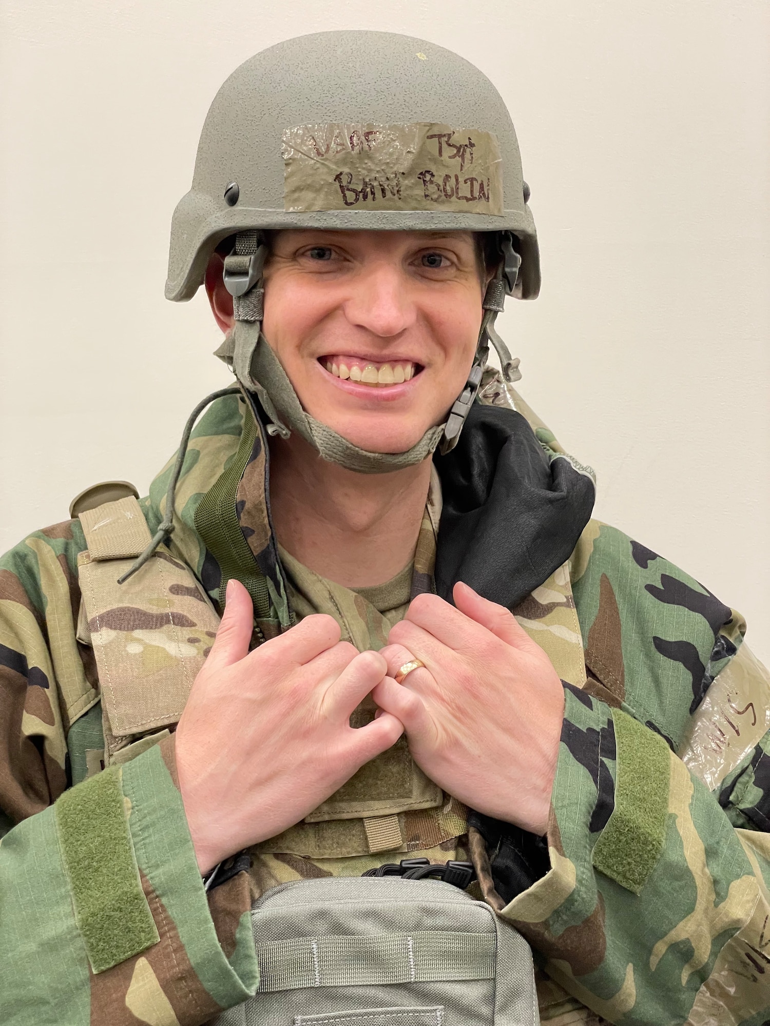 a soldier close up wearing protective gear including a flak jacket and helmet