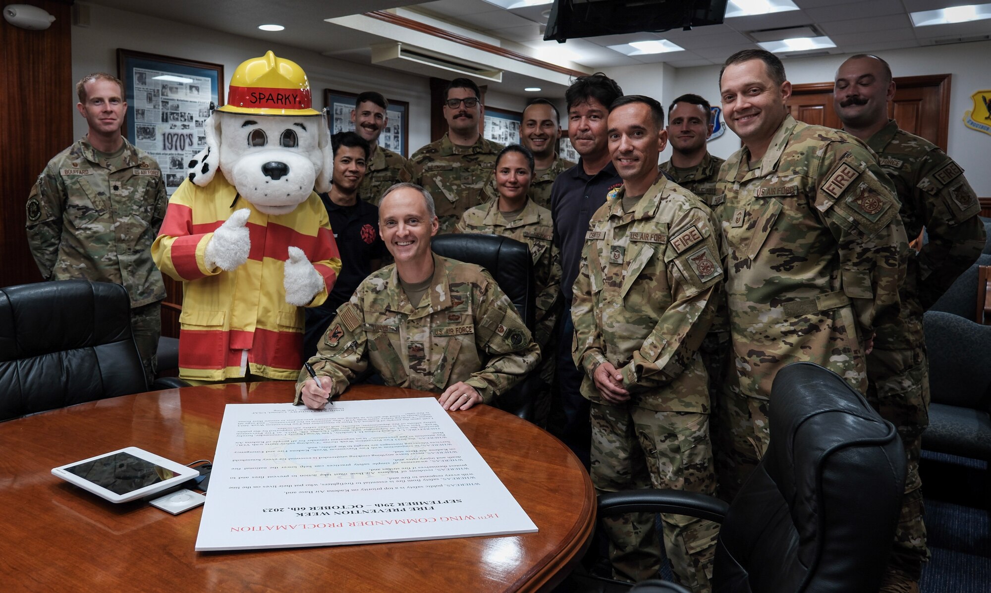Col. Lundeby poses with 18th Wing Civil Engineer members