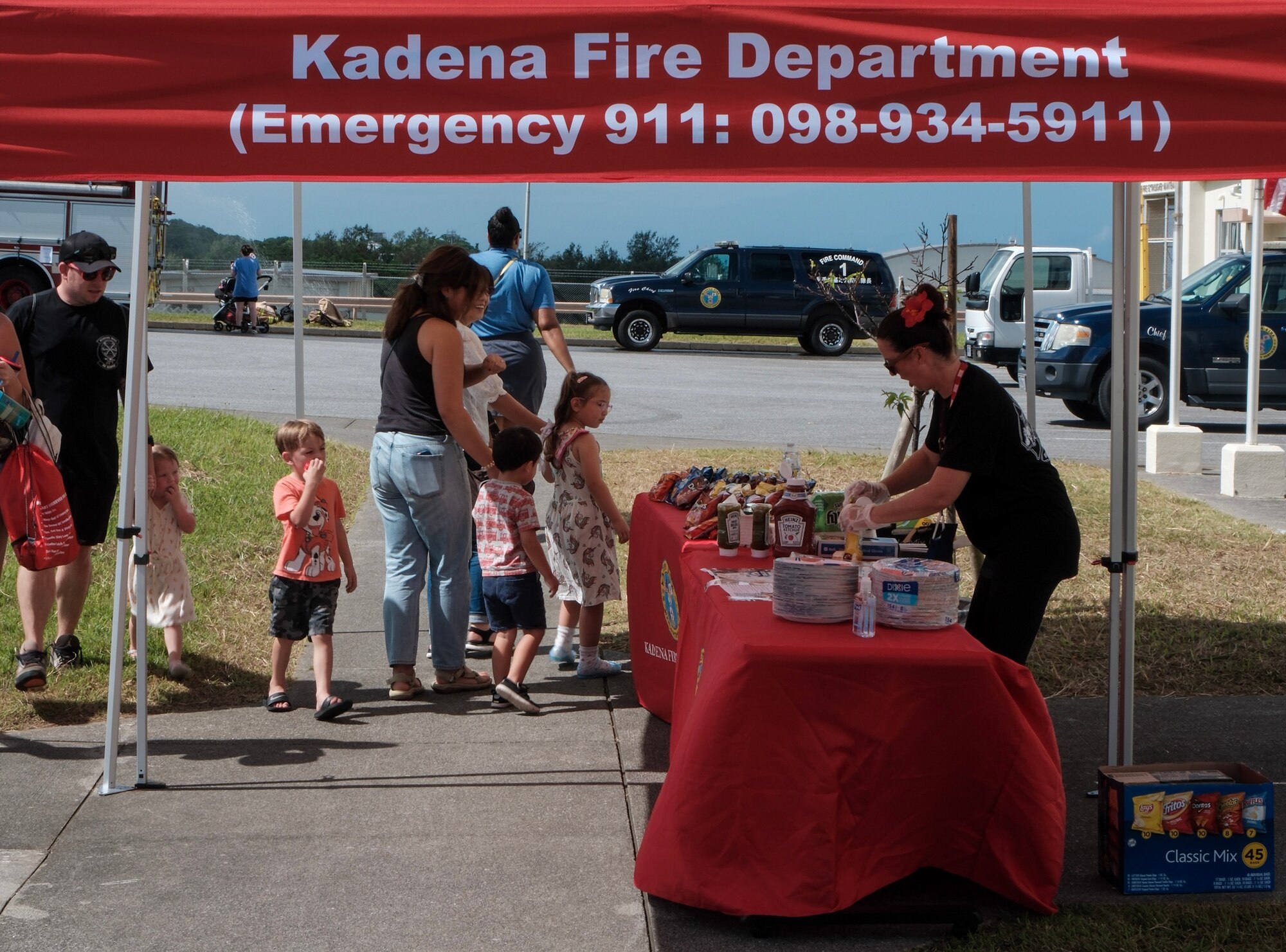 Participants wait at fire prevention merchandise stand