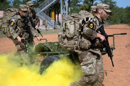 Soldiers representing the Army National Guard evacuate a simulated casualty during the 2023 U.S. Army Best Squad Competition at Fort Stewart, Georgia, Oct. 2, 2023. Twelve squads from throughout the Army competed to be named the Army’s Best Squad, and for individual Soldiers to earn the title Soldier or Noncommissioned Officer of the Year.