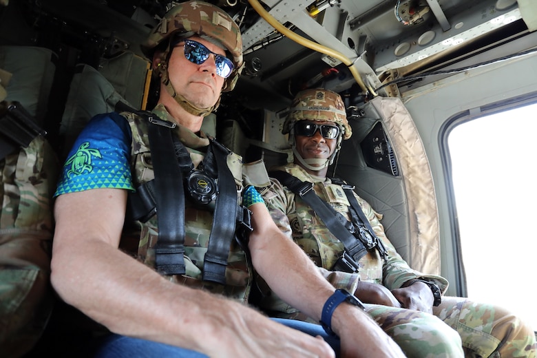 U.S. Army Command Sgt. Maj. Clifton D. Morehouse, U.S. Army Corps of Engineers Transatlantic Division senior enlisted advisor (right), and Eddie Johnson, Transatlantic Expeditionary District Engineering & Construction Division chief (left), ride in a UH-60 Blackhawk helicopter after an inspection of Transatlantic Expeditionary District projects in Baghdad, Iraq Sept. 20. (U.S. Army photo by Rick Rzepka, U.S. Army Corps of Engineers Transatlantic Expeditionary District public affairs office)