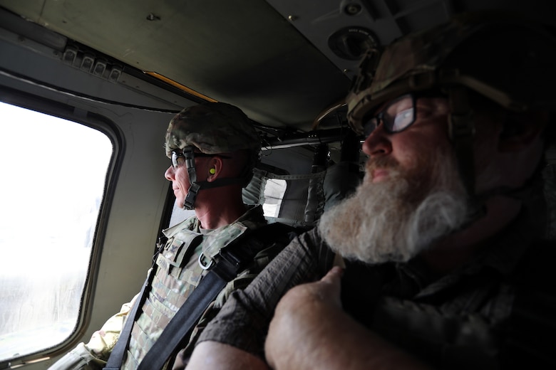 U.S. Army Col. William C. Hannan, Jr., U.S. Army Corps of Engineers Transatlantic Division commander (left), rides in a UH-60 Blackhawk helicopter after an inspection of Transatlantic Expeditionary District projects in Baghdad, Iraq Sept. 20. (U.S. Army photo by Rick Rzepka, U.S. Army Corps of Engineers Transatlantic Expeditionary District public affairs office)