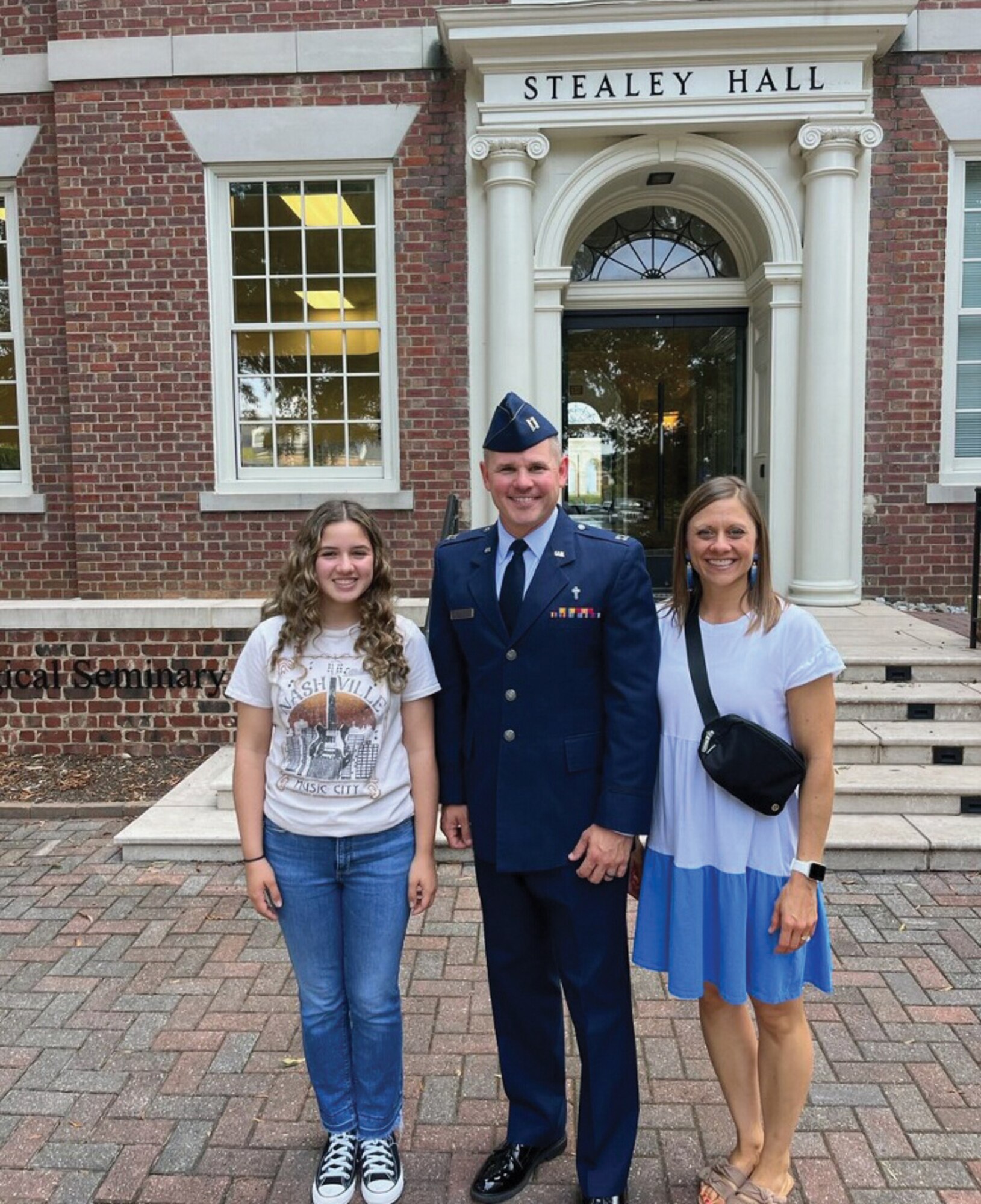 U.S. Air Force Chaplain (Capt.) Patrick Stalnaker, 445th Airlift Wing Chaplain Corps, poses with his daughter, Adeline, and wife, Anne, on the campus of Southeastern Baptist Theological Seminary in Wake Forest, North Carolina, Sept. 7, 2023. (Courtesy photo)