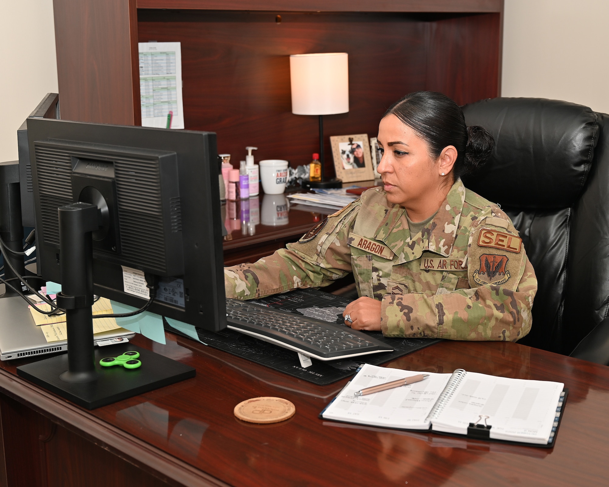 Maryland Air National Guard Senior Master Sgt. Monica Aragon, 175th Logistics Readiness Squadron senior enlisted leader, works at a computer terminal at Martin State Air National Guard Base, Middle River, Md., October 11, 2023.