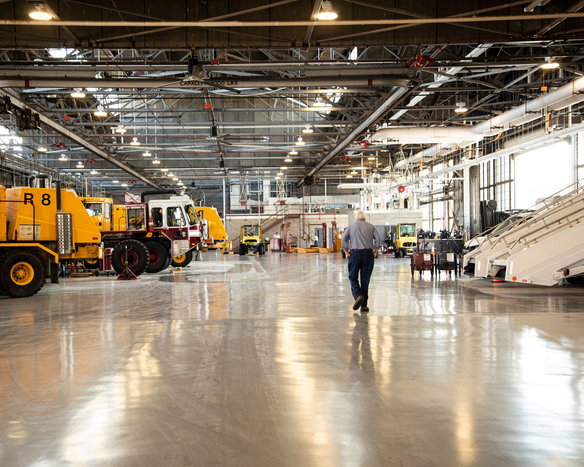 Man walks through warehouse.