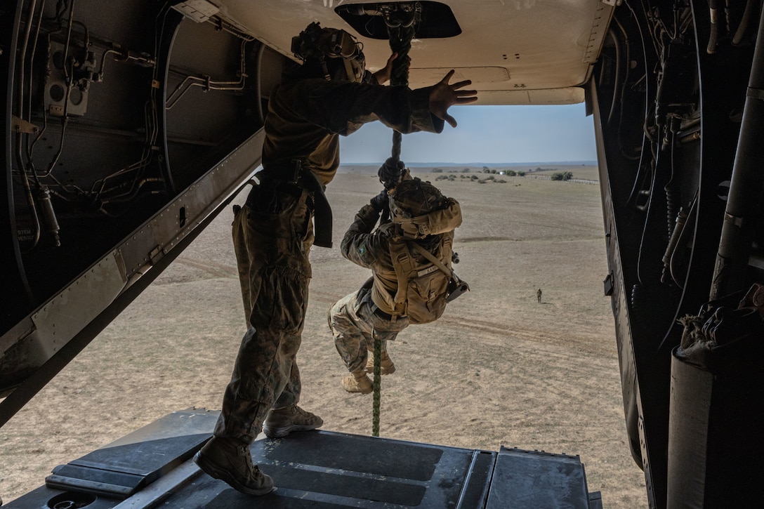 U.S. Marines with Combined Anti-armor Team Red, Weapons Company, Battalion Landing Team 1/6, 26th Marine Expeditionary Unit (Special Operations Capable) (MEU(SOC)) conduct fast rope training at Sierra del Retin Training Camp, Oct. 6, 2023. The San Antonio-class amphibious transport docking ship USS Mesa Verde, assigned to the Bataan Amphibious Ready Group and embarked 26th Marine Expeditionary Unit (Special Operations Capable) (MEU(SOC)), under the command and control of Task Force 61/2, is on a scheduled deployment in the U.S. Naval Forces Europe area of operations, employed by U.S. Sixth Fleet to defend U.S., Allied, and partner interests. (U.S. Marine Corps photo by Cpl. Michele Clarke)