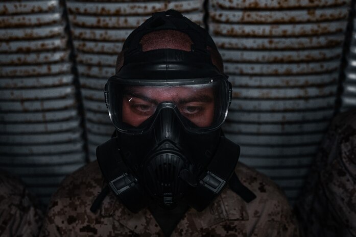 A U.S. Marine Corps recruit with Alpha Company, 1st Recruit Training Battalion, stands in the confidence chamber at Marine Corps Base Camp Pendleton, Calif., Oct. 10, 2023. The confidence chamber trained recruits how to properly use the M40 gas mask and respond to potential chemical and biological threats. (U.S. Marine Corps photo by Cpl. Alexander O. Devereux)