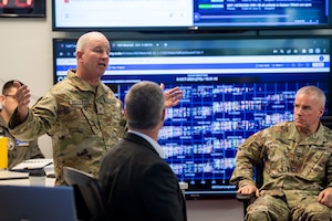 Man in military uniform speaks to an audience