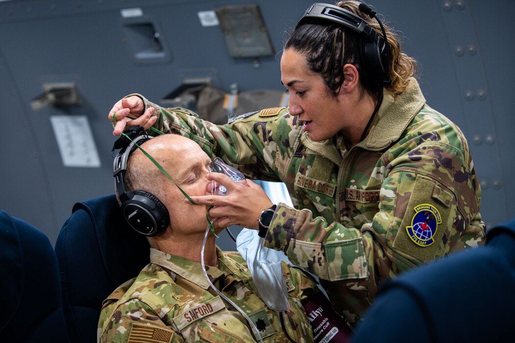Image of an Airmen training with a patient.