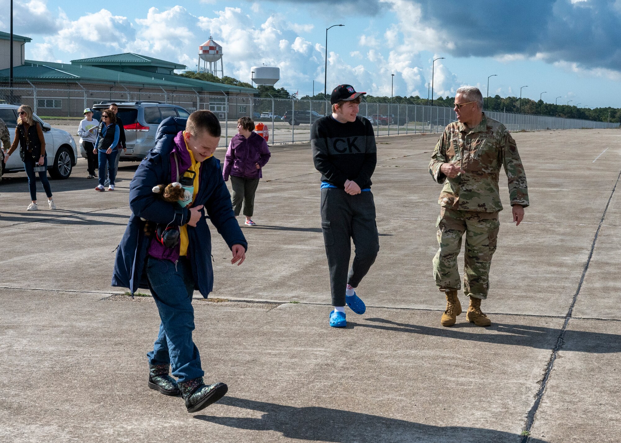 Massachusetts National Guard Airmen and Soldiers, firefighters from the Joint Base Cape Cod Fire Department and troopers from the Massachusetts State Police joined forces to welcome 40 students of Latham Centers for an “Airman for a Day” event held at Otis Air National Guard Base, on Oct. 11, 2023.
