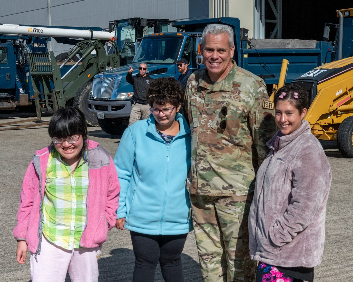 Massachusetts National Guard Airmen and Soldiers, firefighters from the Joint Base Cape Cod Fire Department and troopers from the Massachusetts State Police joined forces to welcome 40 students of Latham Centers for an “Airman for a Day” event held at Otis Air National Guard Base, on Oct. 11, 2023.