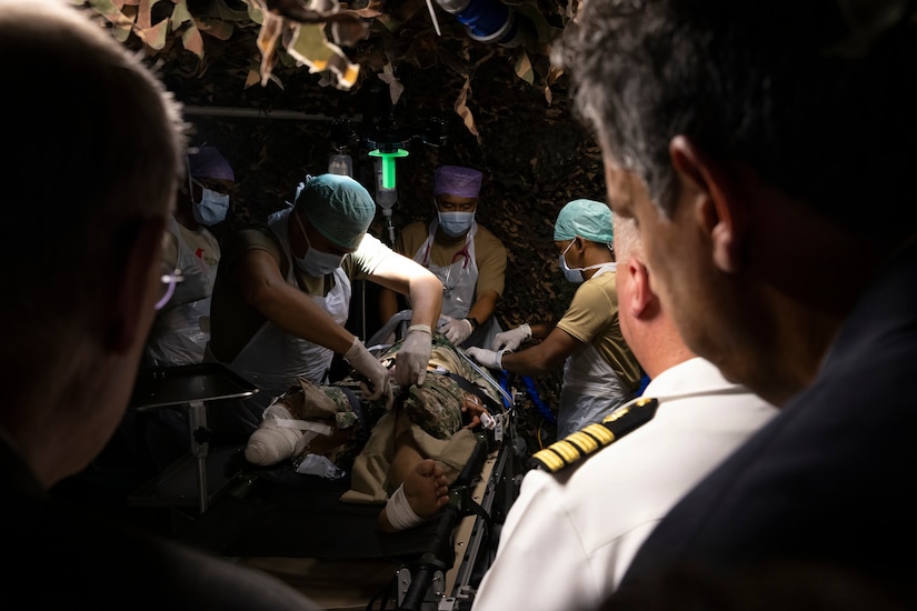 Dignitaries and senior military service members view a surgical demonstration inside a field hospital handed over from U.S. Info-Paficic Command to the Malaysian Armed Forces during Indo-Pacific Military Health Exchange 2023 in Kuala Lumpur, Malaysia, September 28, 2023.