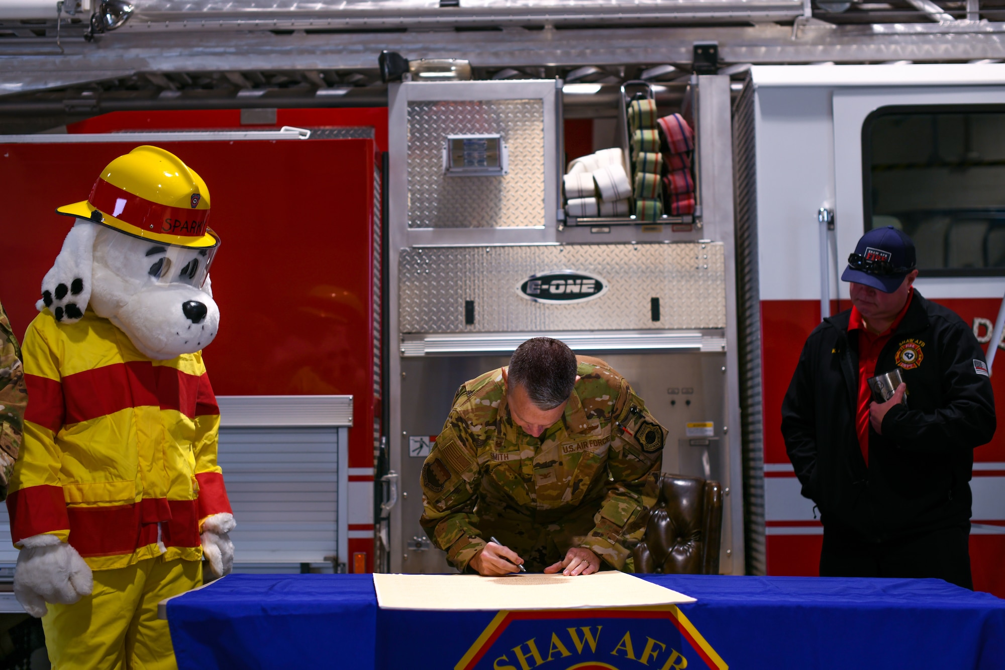 Military leadership signs the Fire Prevention Week proclamation.