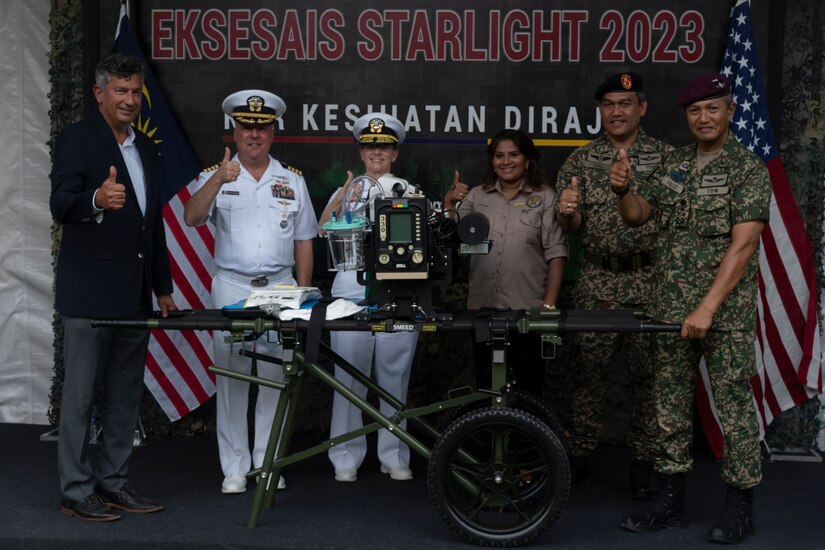 Officials representing U.S. Embassy Malaysia, U.S. India-Pacific Command, and the Malaysian Armed Forces pose after U.S. Charge d’affaires, a.i. Manu Bhalla, the deputy chief of mission at USEMB-Malaysia officiated the handover of two mobile Role 2 surgical/critical care systems and a Role 3 field hospital from USINDOPACOM to the MAF during Indo-Pacific Military Health Exchange 2023 in Kuala Lumpur, Malaysia, September 28, 2023