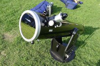 A solar filter is attached to the Sun-facing end of a telescope.