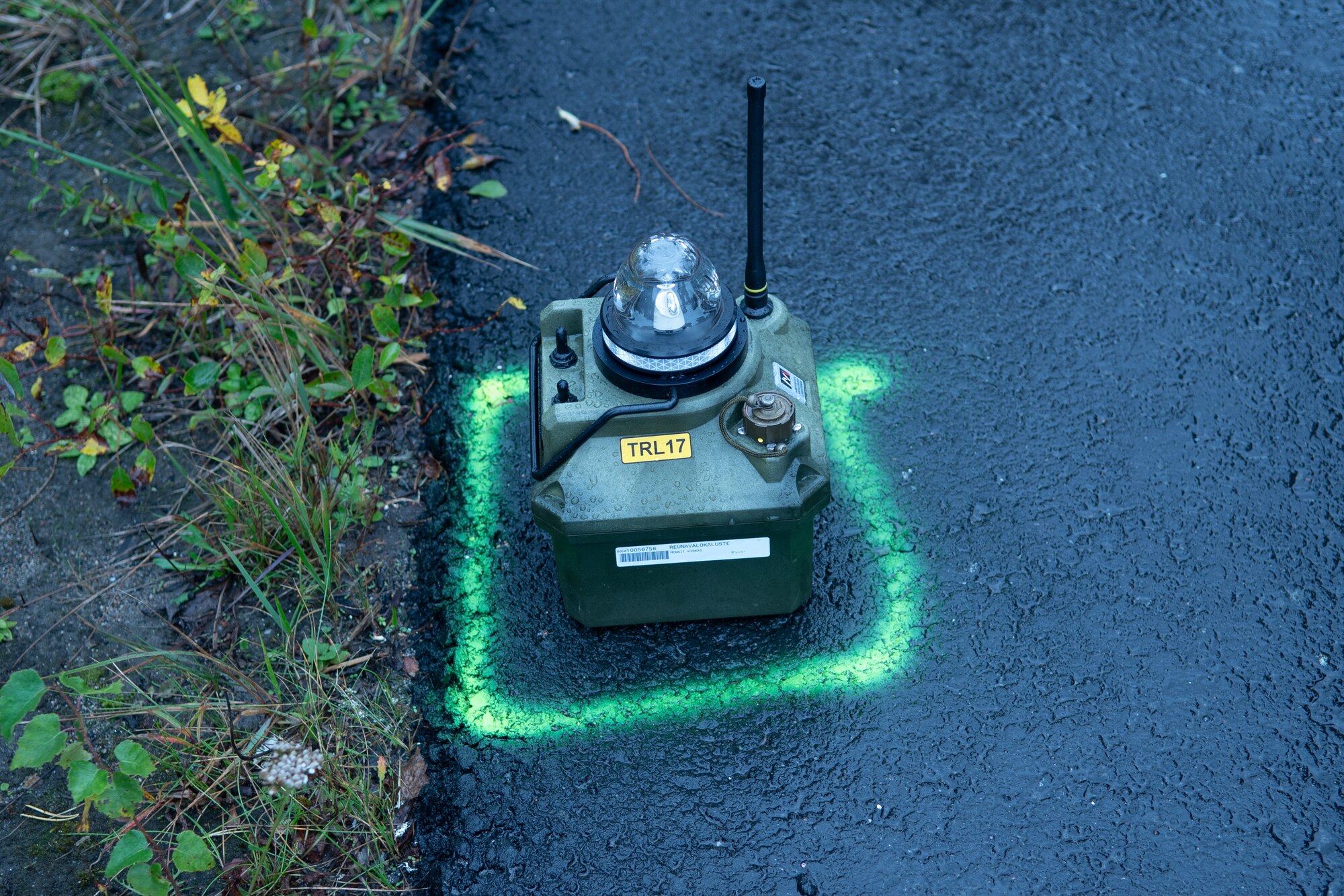 A photo of a box on a paved road.